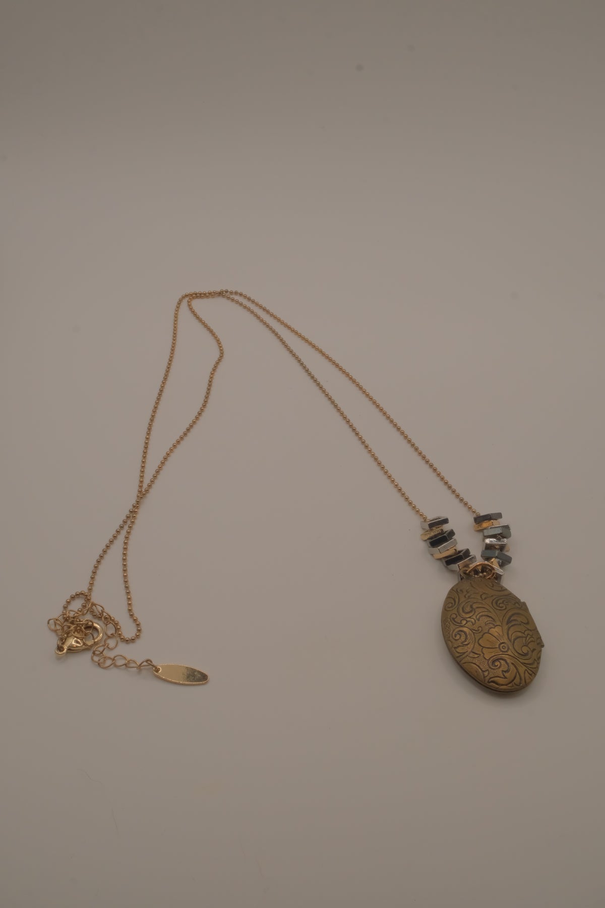 Antique brass-finished floral oval locket necklace&nbsp;