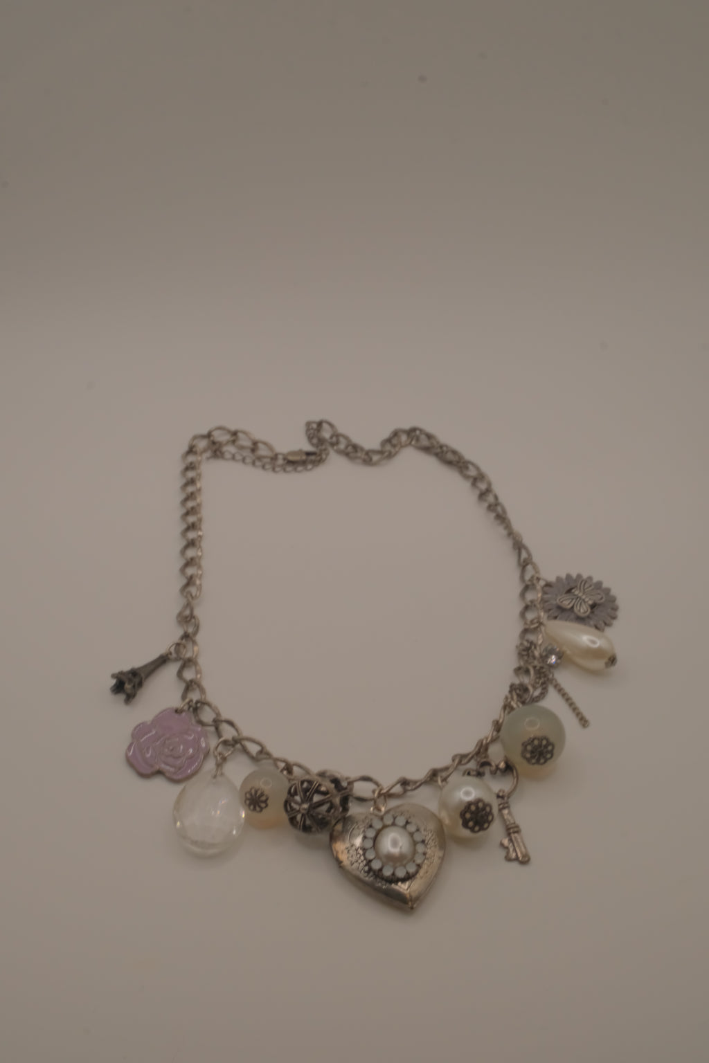 Vintage silver charm necklace with locket