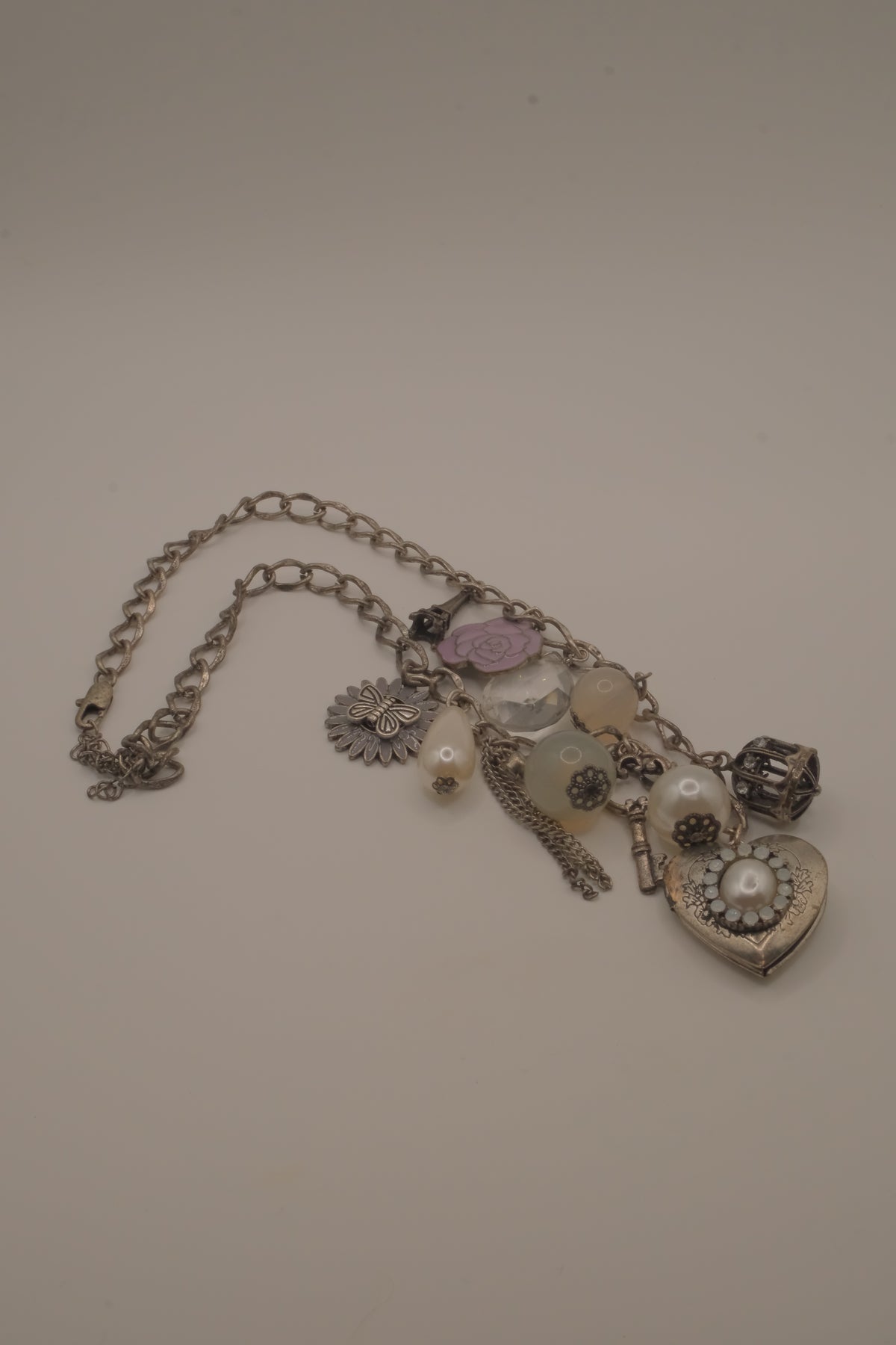 Vintage silver charm necklace with locket