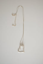 Sterling silver chain with open heart pendant