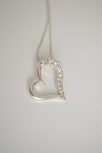 Sterling silver chain with open heart pendant