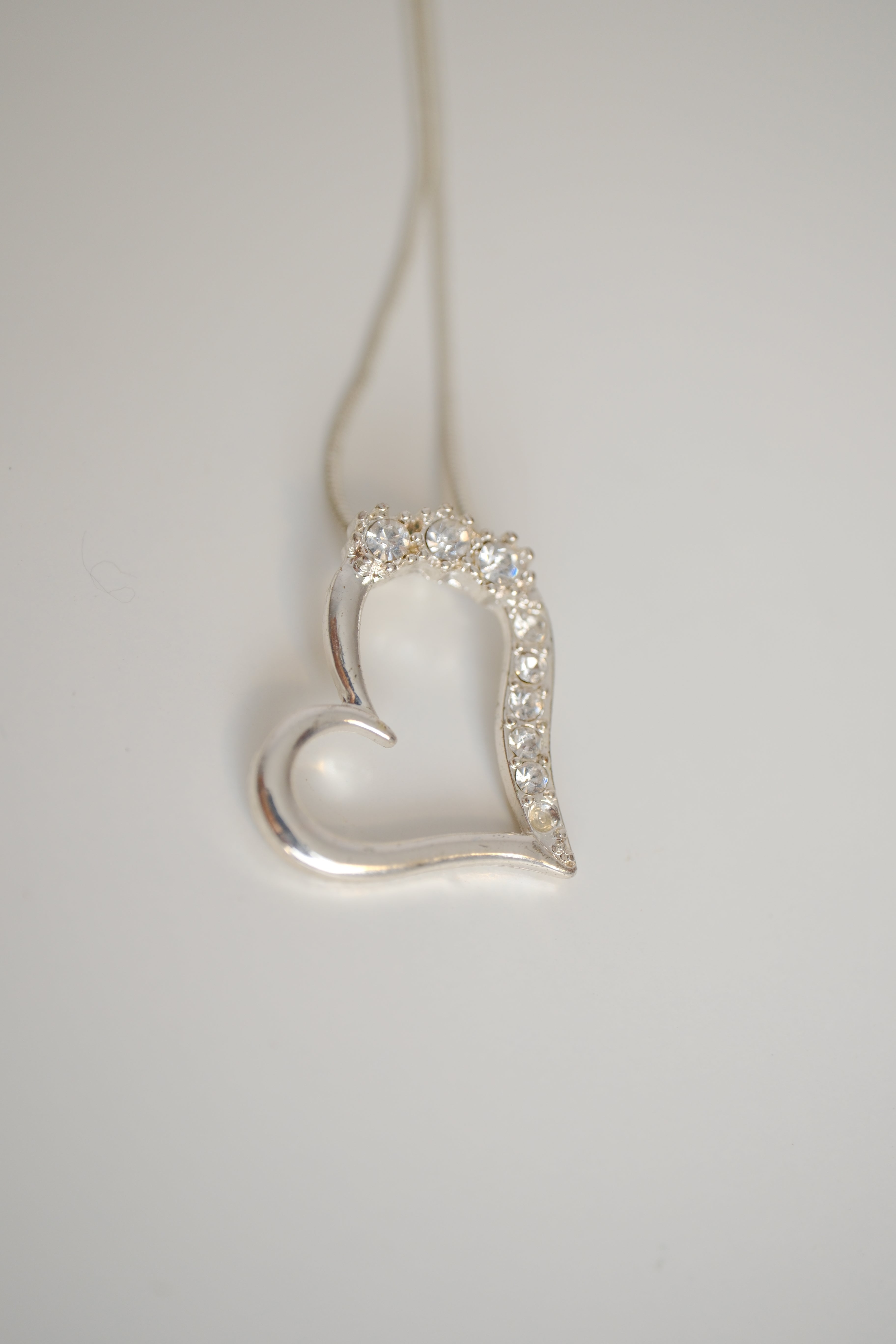 Sterling silver chain with open heart pendant