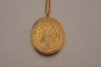 Vintage Victorian-style oval gold locket pendant