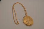 Vintage Victorian-style oval gold locket pendant