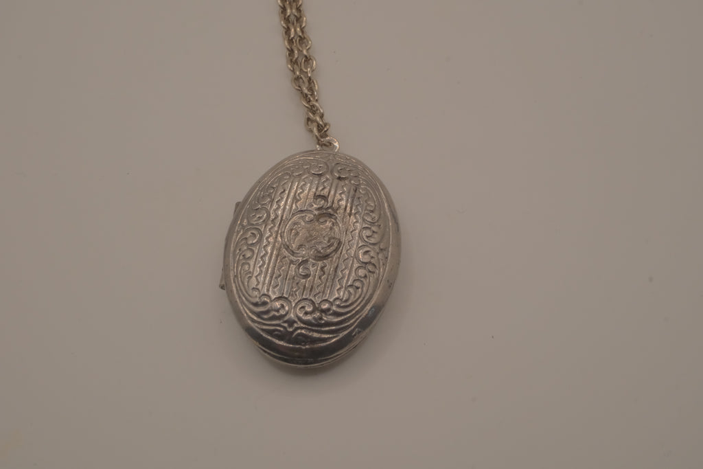 Antique oval Victorian style silver locket pendant