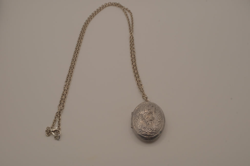 Antique oval Victorian style silver locket pendant