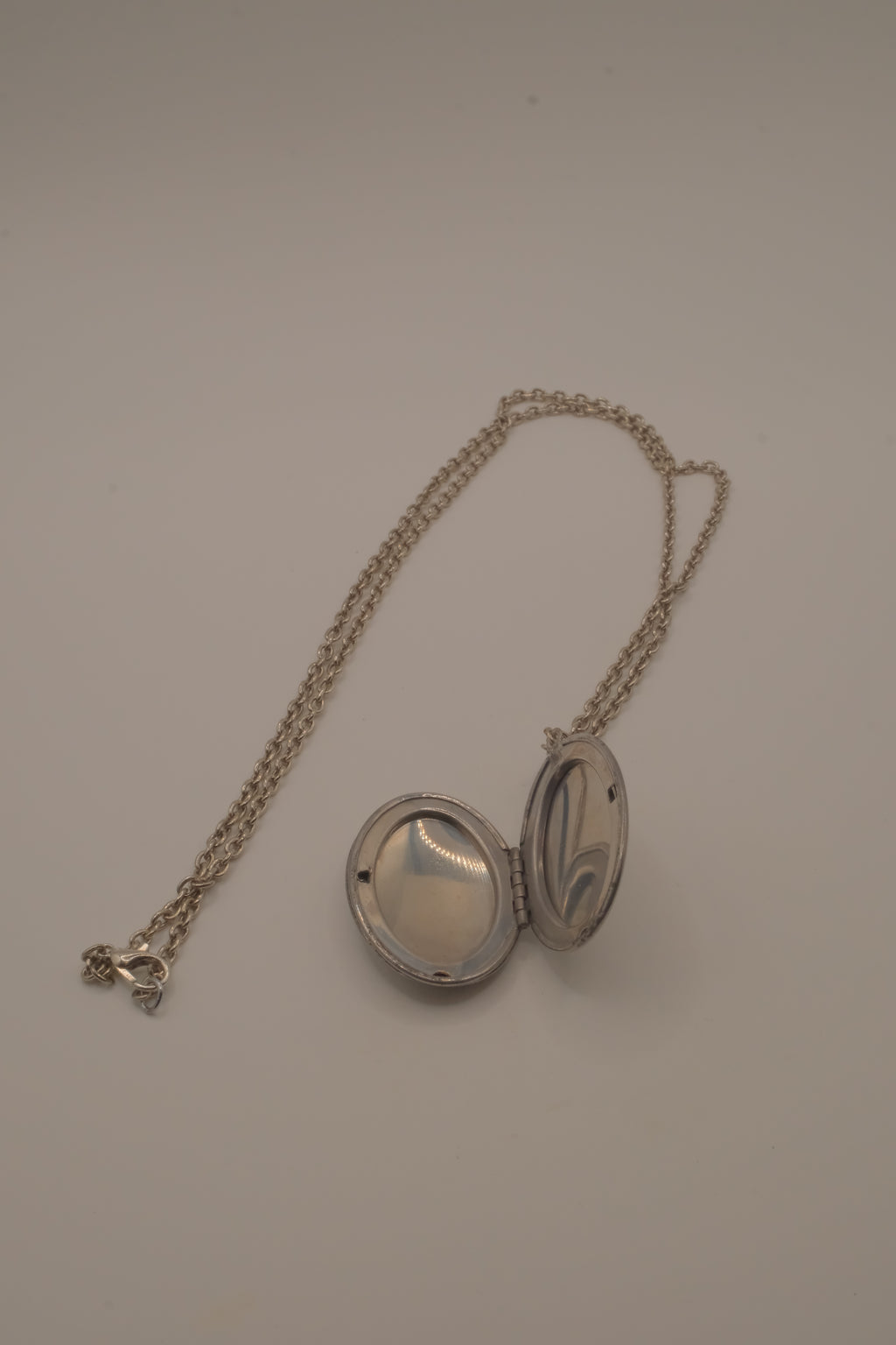 Antique oval Victorian style silver locket pendant