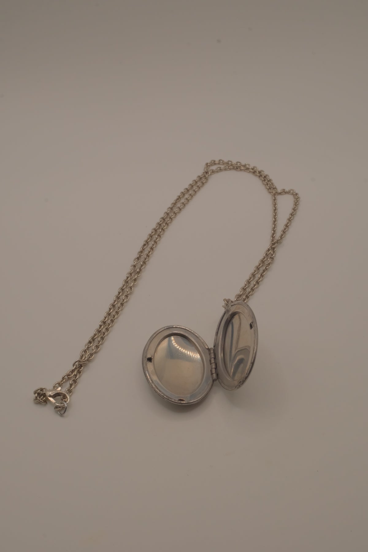 Antique oval Victorian style silver locket pendant