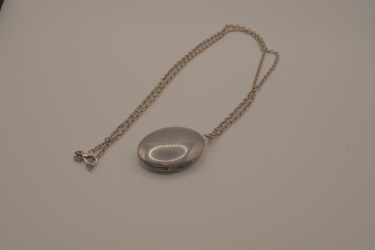 Antique oval Victorian style silver locket pendant