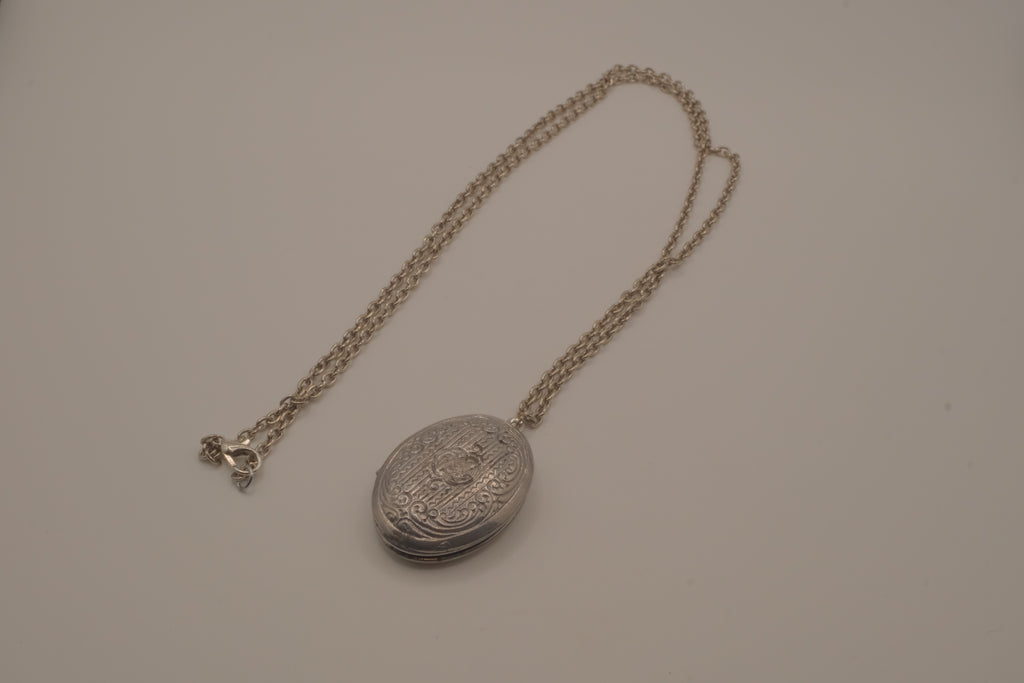 Antique oval Victorian style silver locket pendant