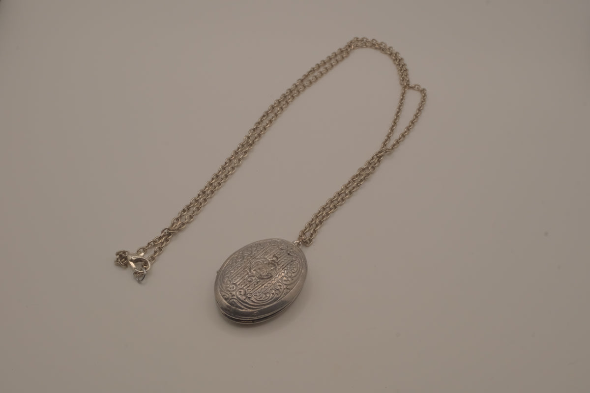 Antique oval Victorian style silver locket pendant