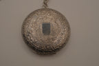 Antique chased floral motif locket necklace