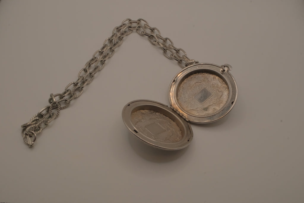 Antique chased floral motif locket necklace