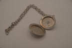Antique chased floral motif locket necklace