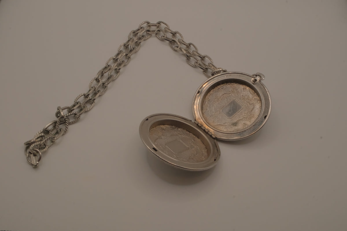 Antique chased floral motif locket necklace