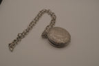 Antique chased floral motif locket necklace