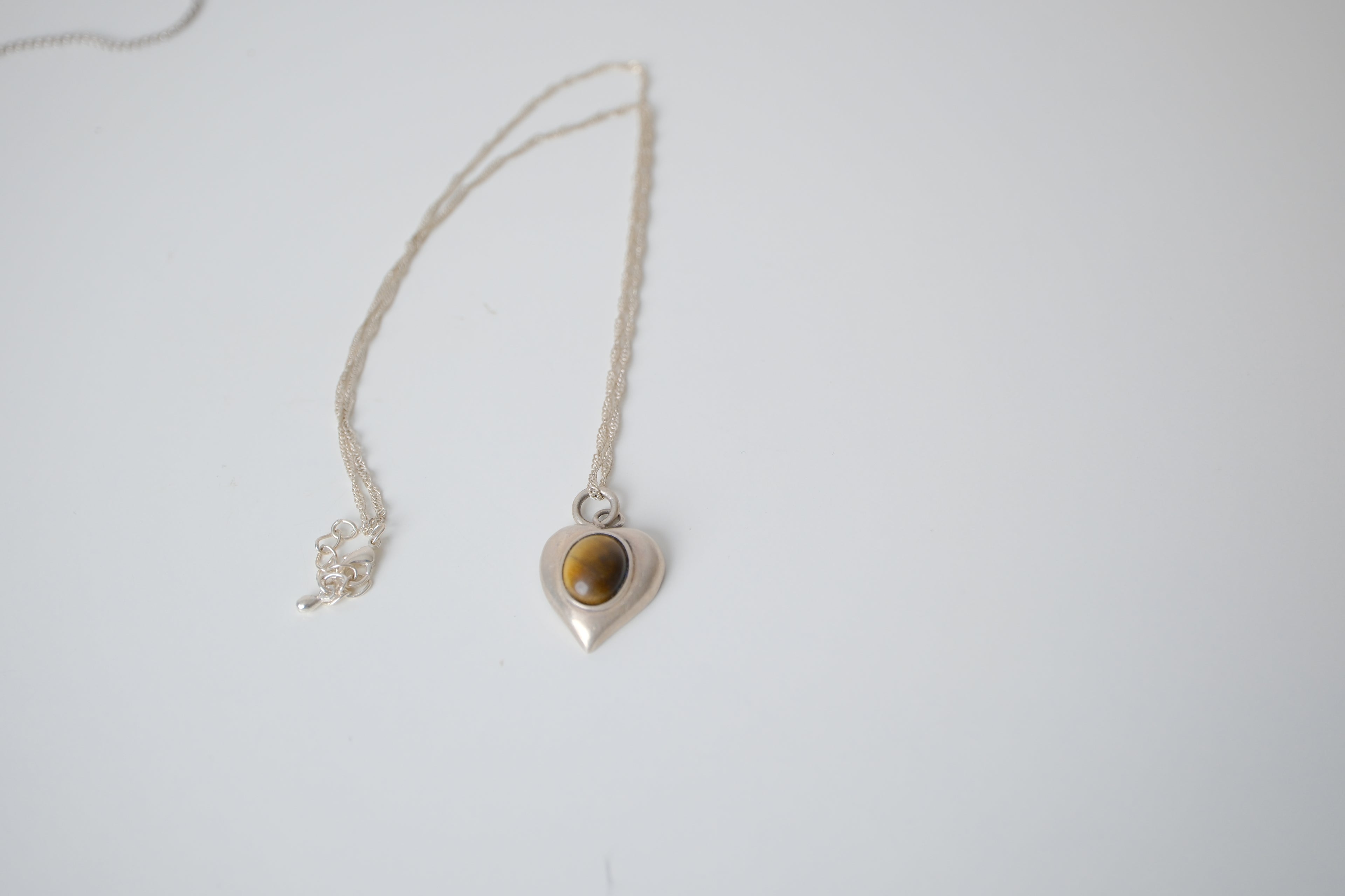 Sterling silver tiger's eye heart pendant
