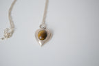 Sterling silver tiger's eye heart pendant