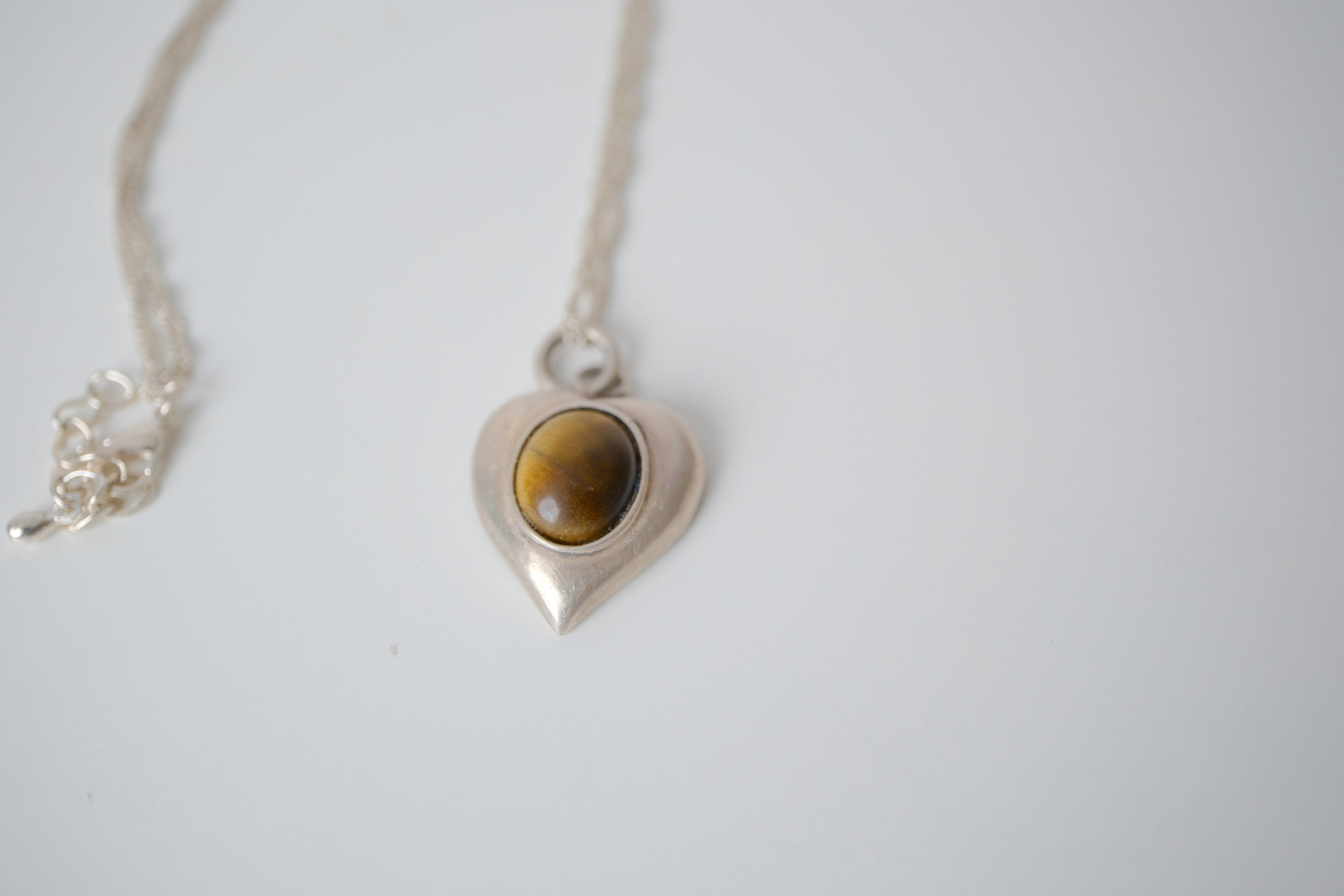 Sterling silver tiger's eye heart pendant