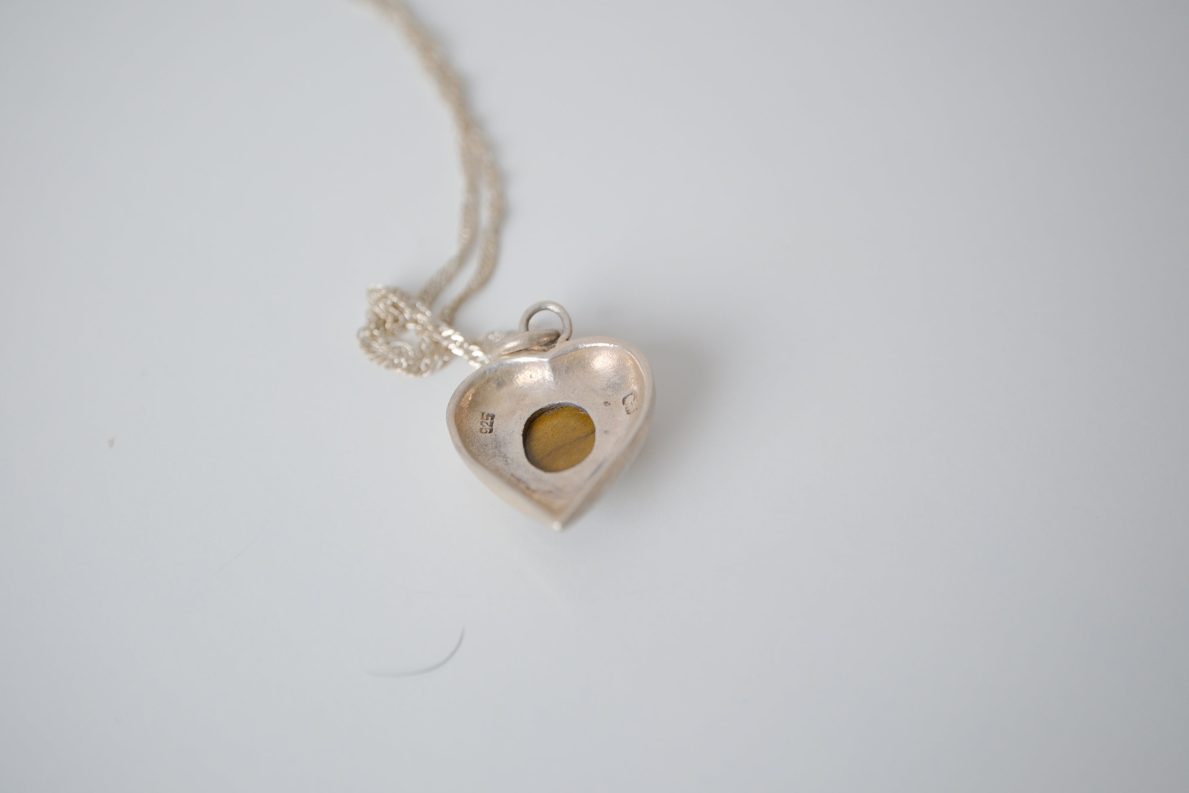 Sterling silver tiger's eye heart pendant