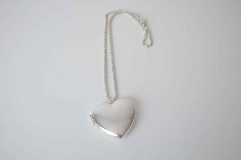 Polished silver heart locket necklace