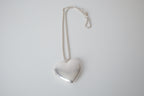 Polished silver heart locket necklace