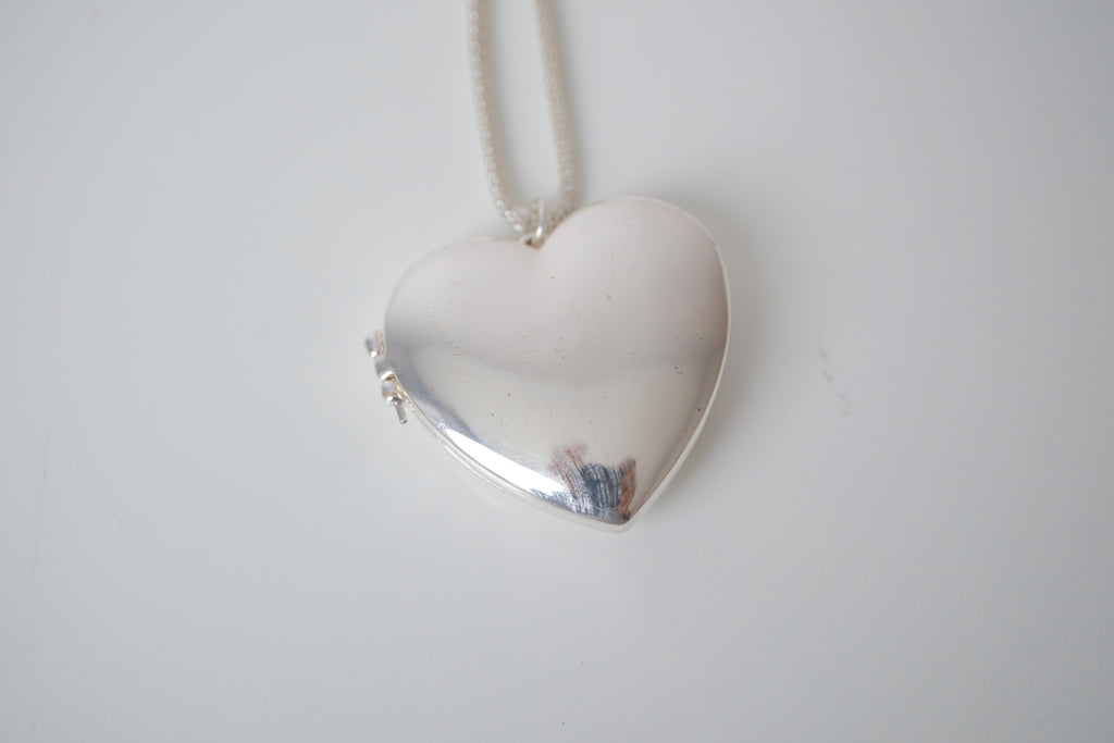 Polished silver heart locket necklace