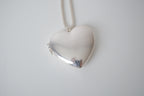 Polished silver heart locket necklace