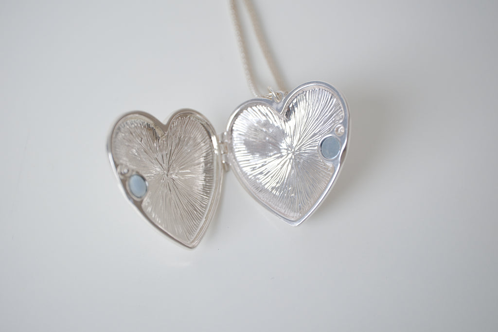Polished silver heart locket necklace