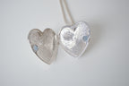 Polished silver heart locket necklace