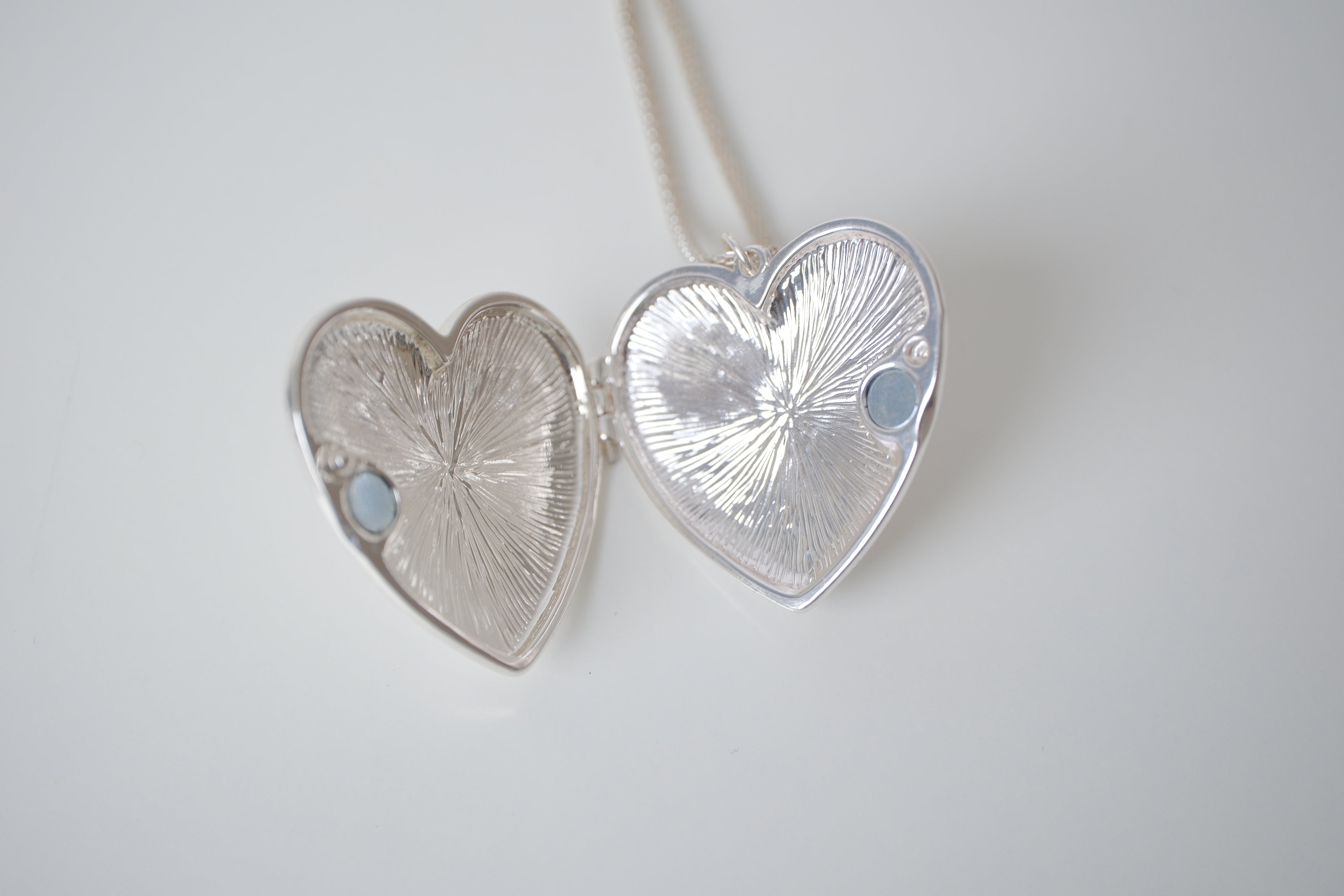 Polished silver heart locket necklace