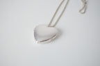 Polished silver heart locket necklace