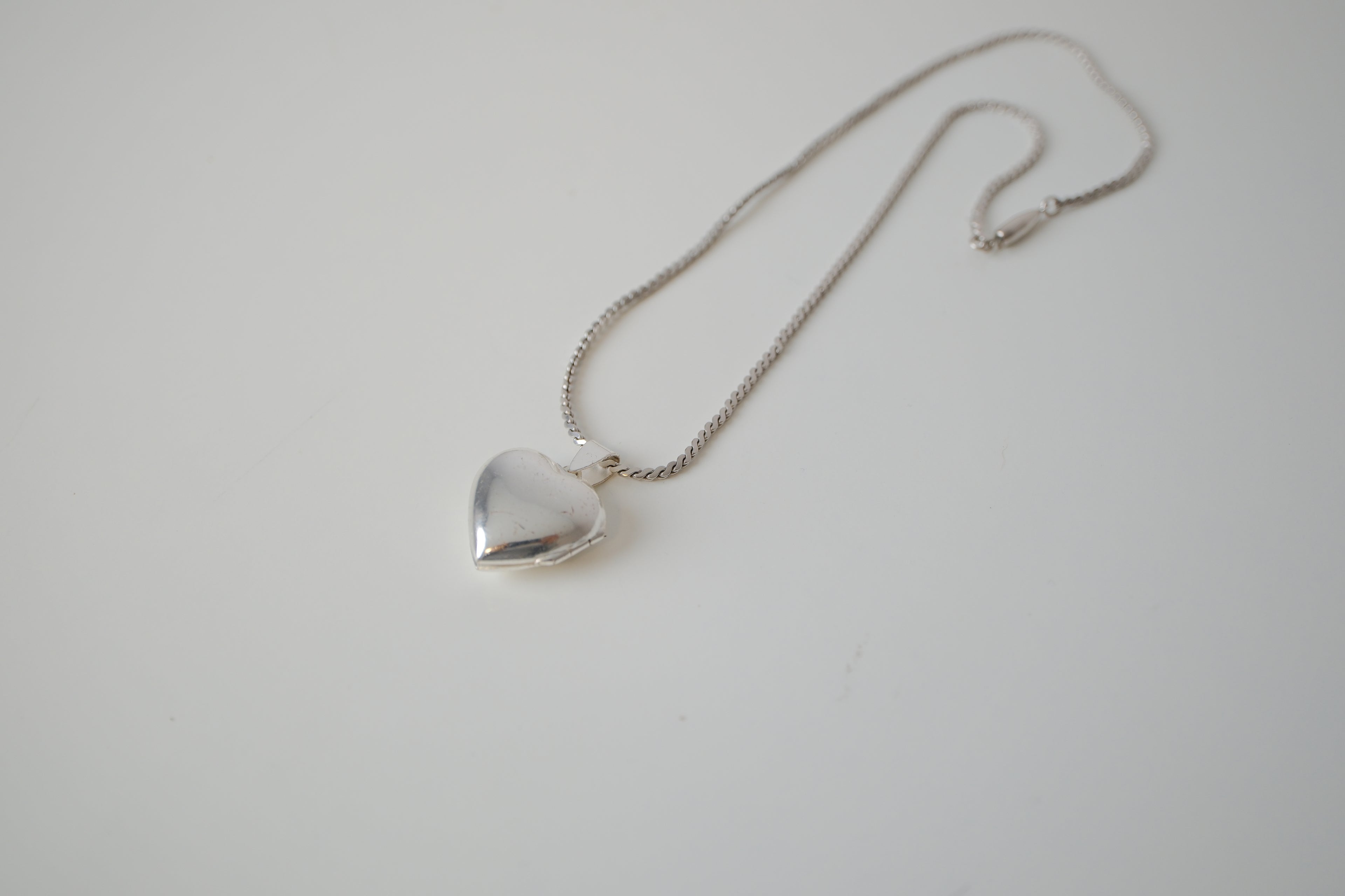 Small shiny heart locket necklace