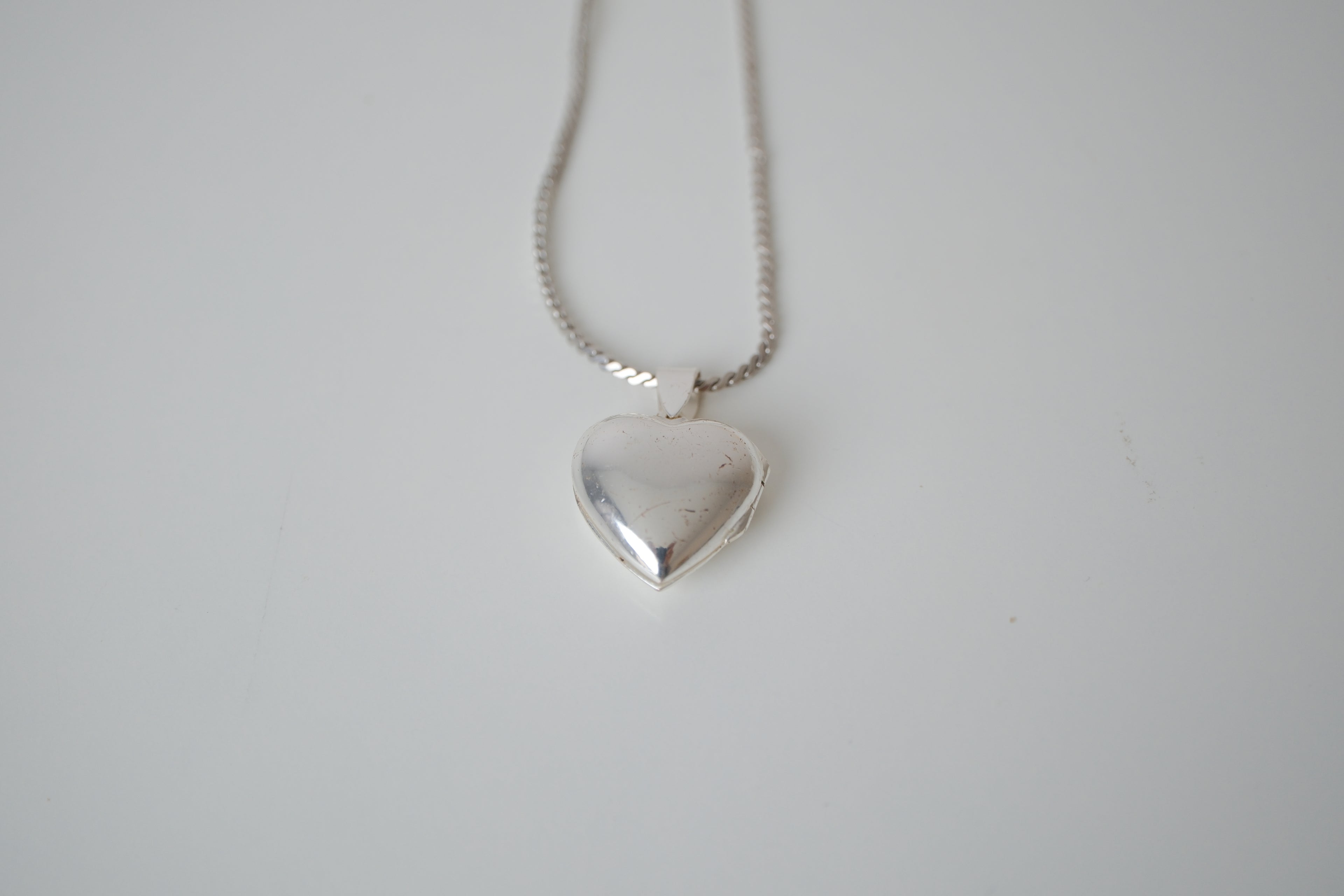 Small shiny heart locket necklace