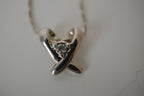 Silver toned Kiss pendant necklace