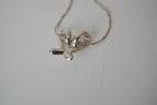 Silver toned Kiss pendant necklace