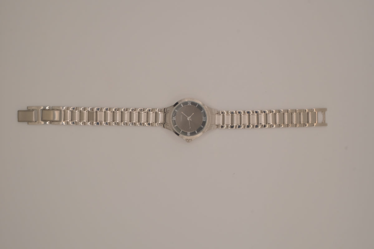 Vintage Avon women's silver-tone dress watch