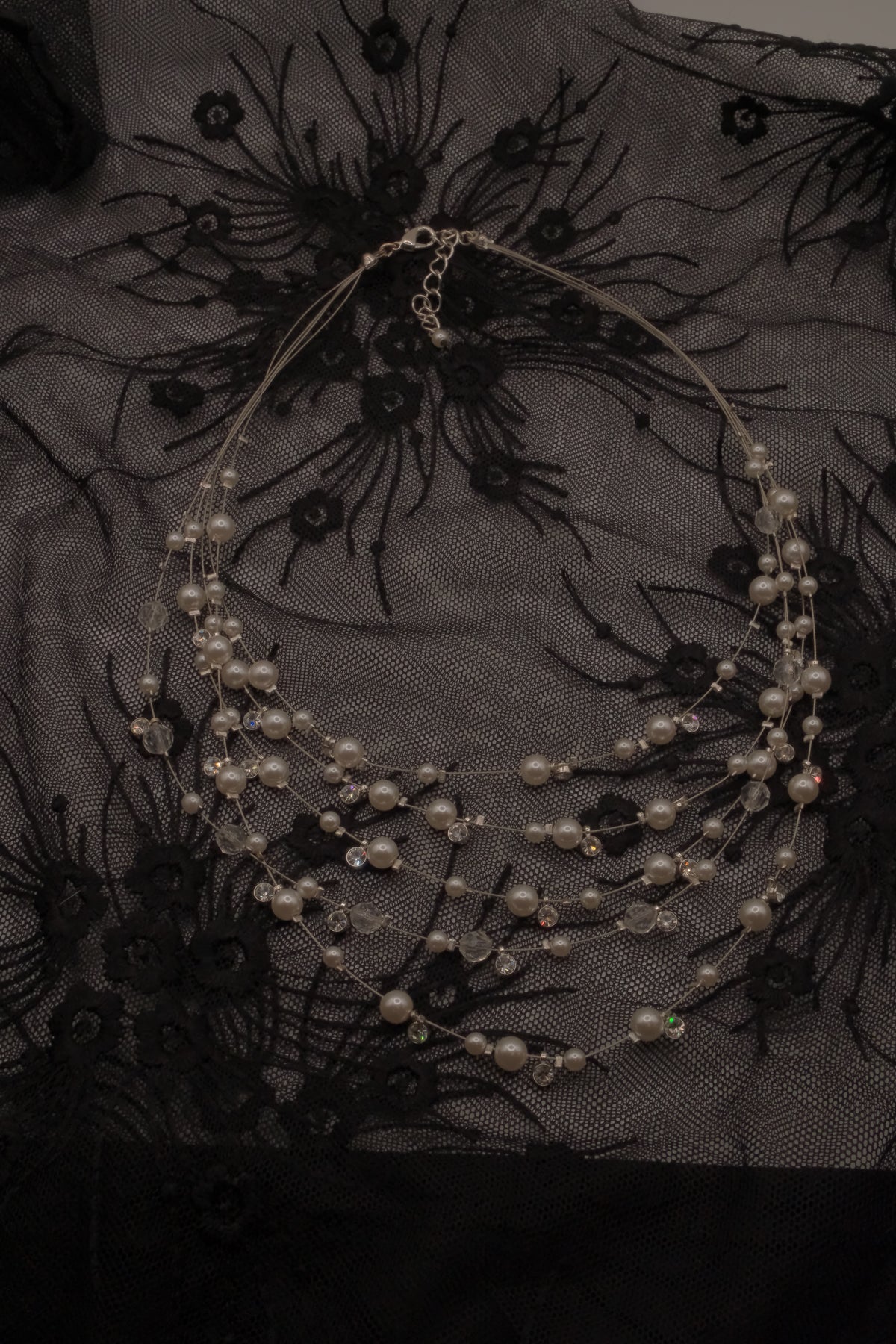 Multi-strand floating pearl illusion necklace