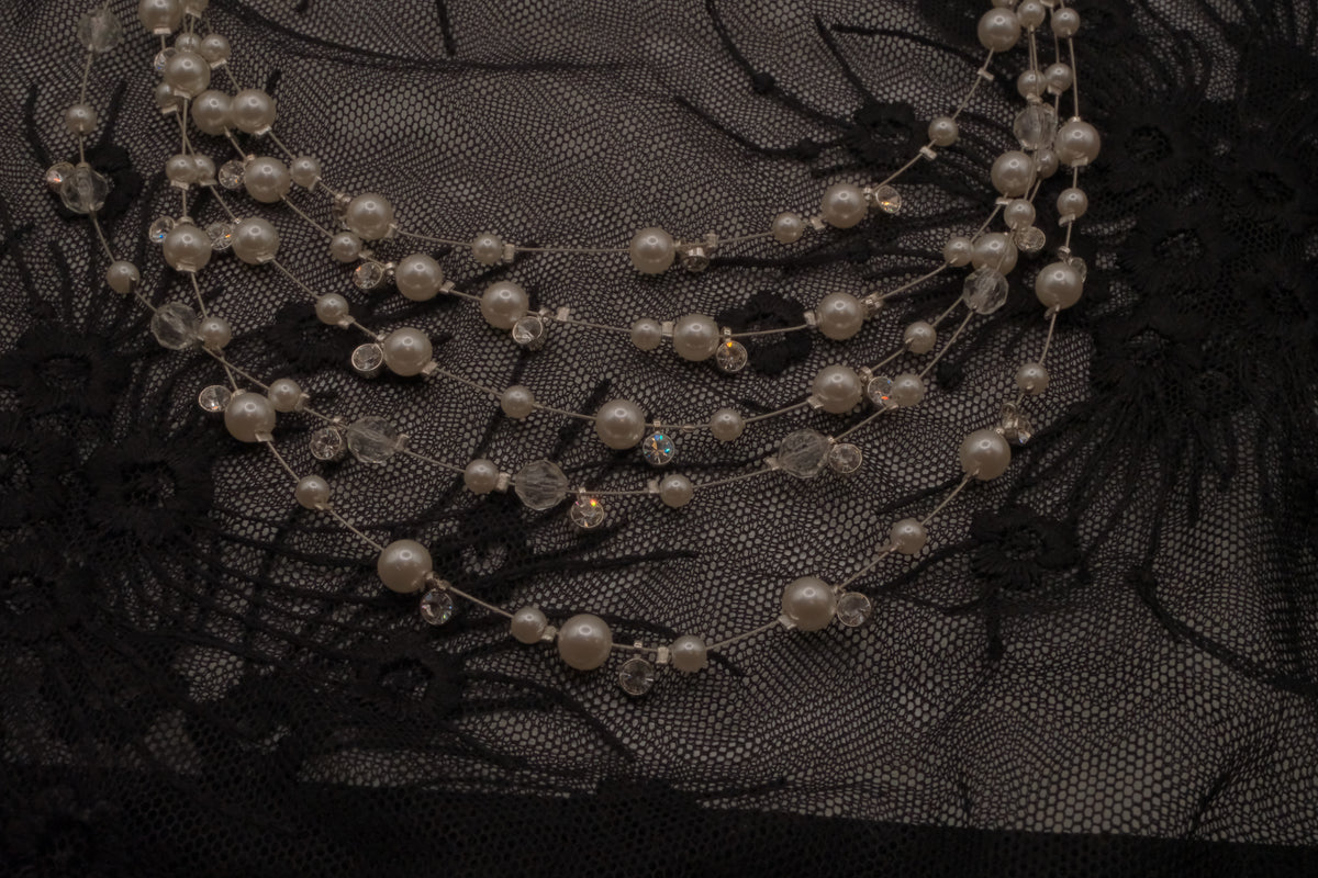 Multi-strand floating pearl illusion necklace