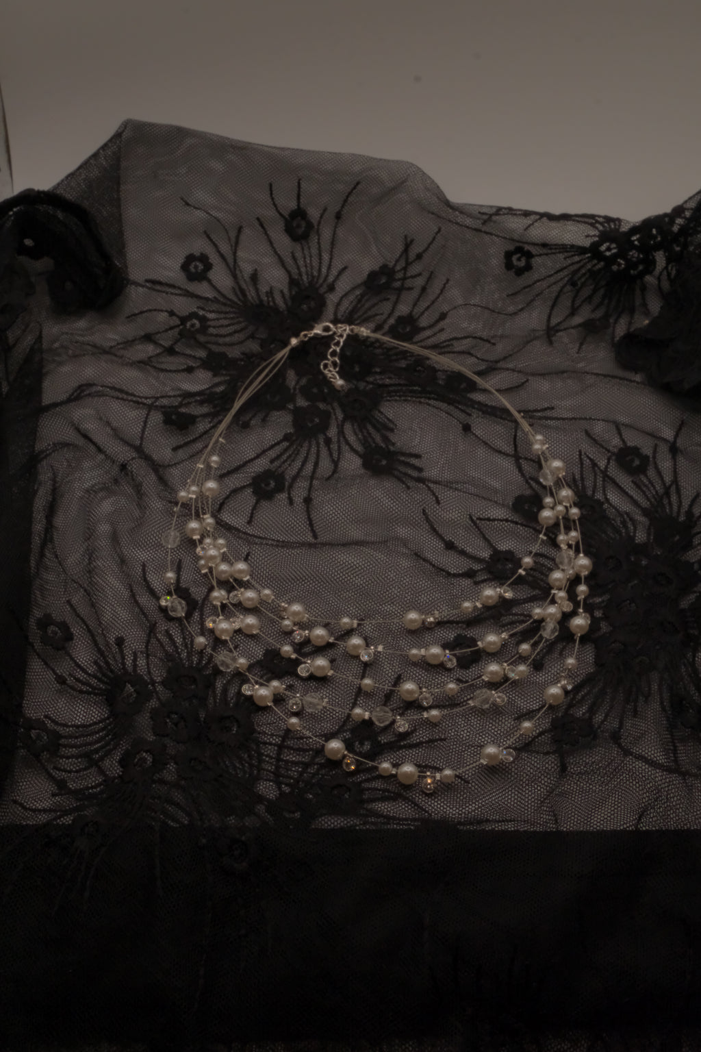 Multi-strand floating pearl illusion necklace