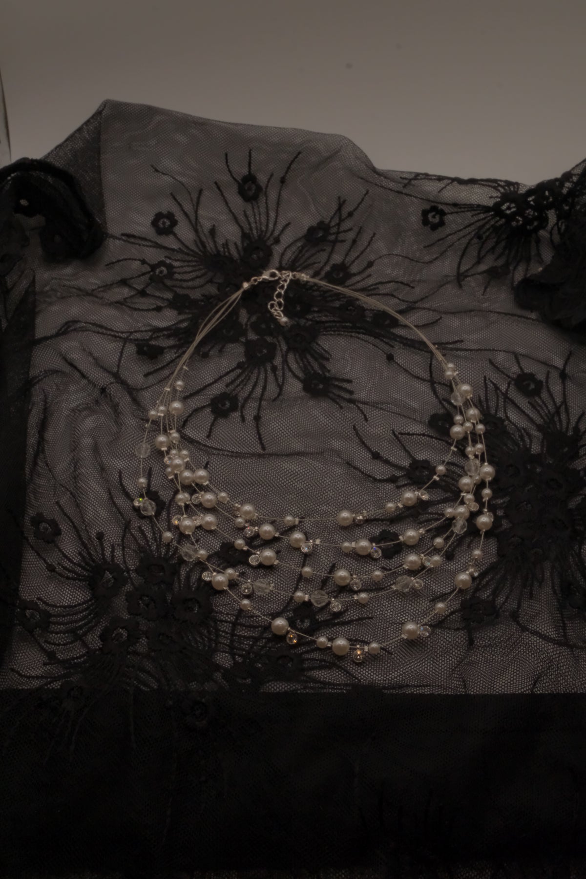 Multi-strand floating pearl illusion necklace