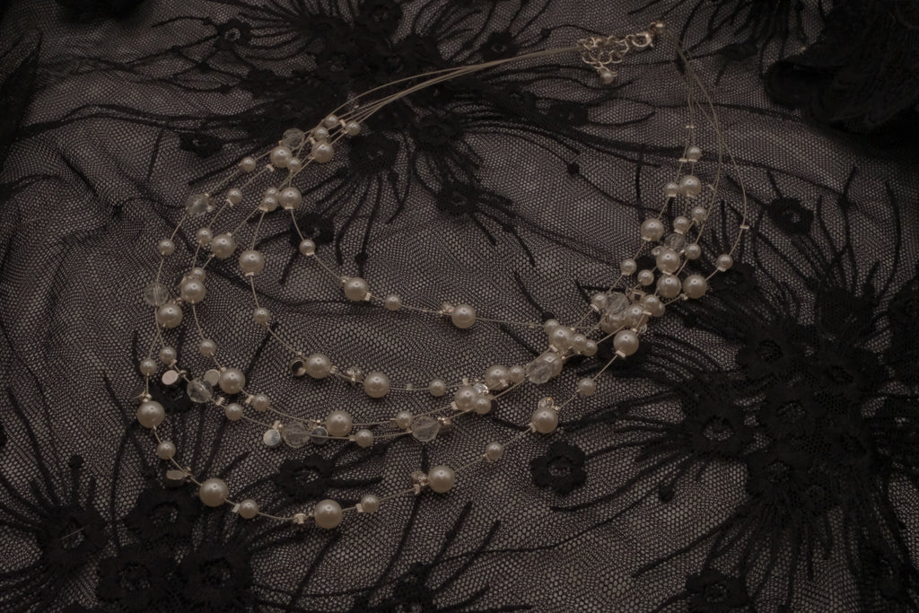Multi-strand floating pearl illusion necklace