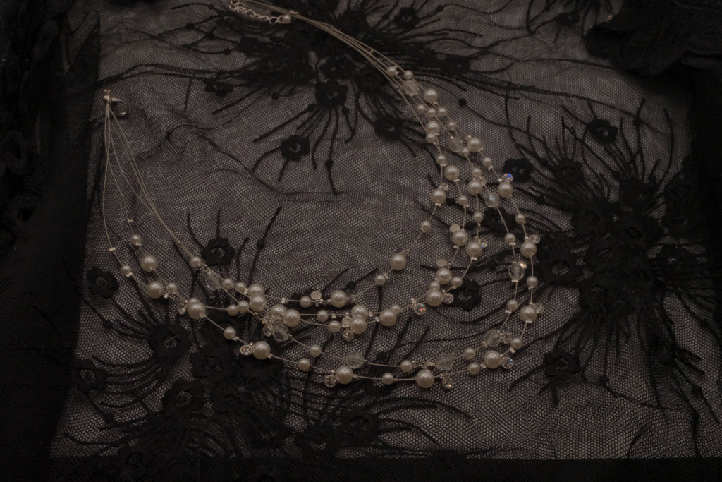 Multi-strand floating pearl illusion necklace