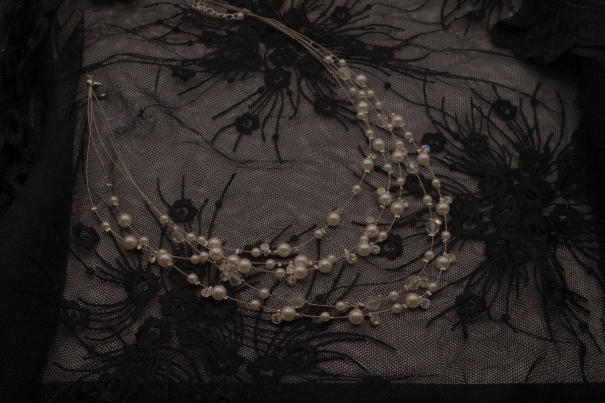 Multi-strand floating pearl illusion necklace