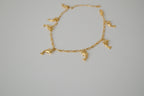 Gold tone dolphin charm bracelet