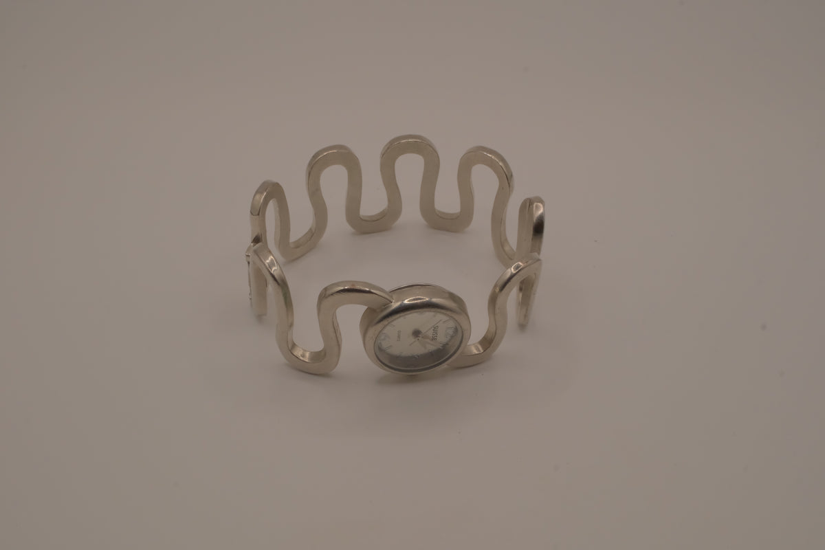 Vintage Suisse silver-tone quartz bangle watch
