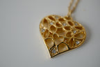 Delicate gold toned openwork heart pendant necklace&nbsp;