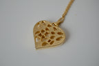 Delicate gold toned openwork heart pendant necklace&nbsp;