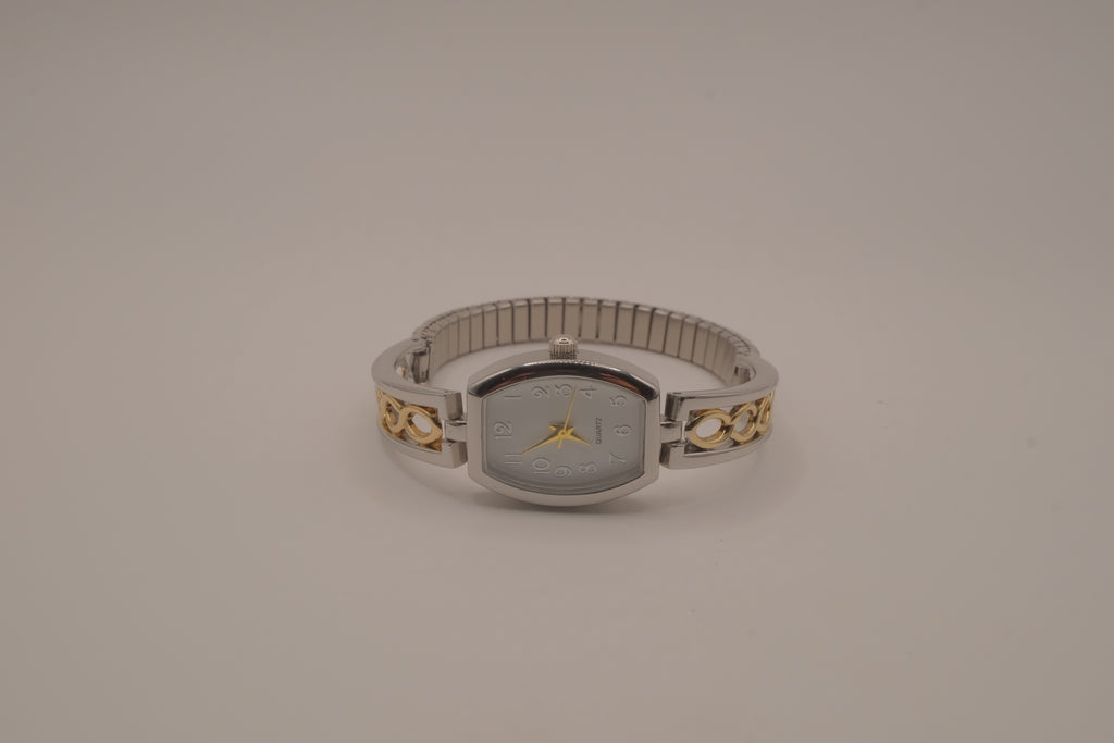 Two-tone filigree expansion watch