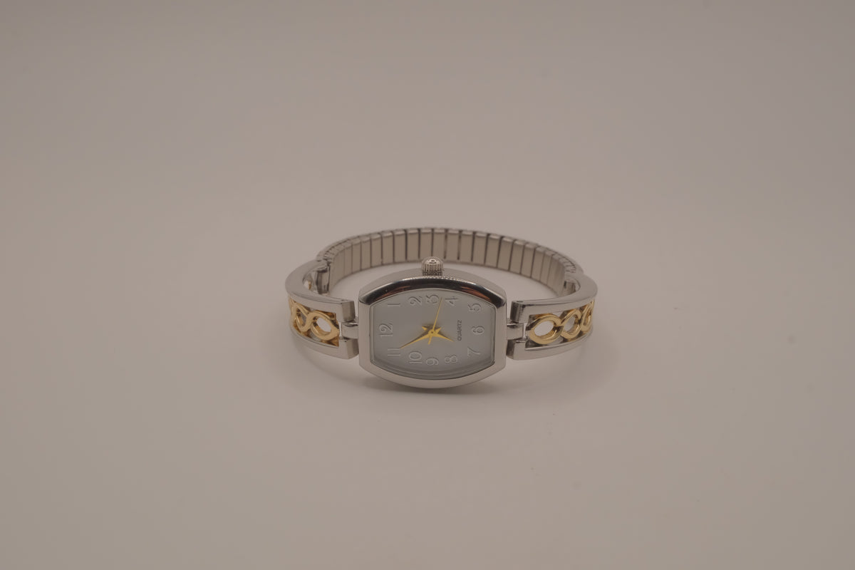 Two-tone filigree expansion watch